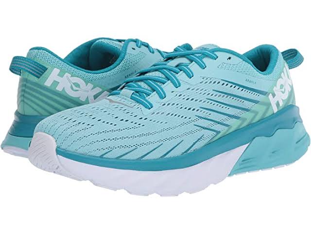 HOKA Arahi 4 stability shoes in black and orange