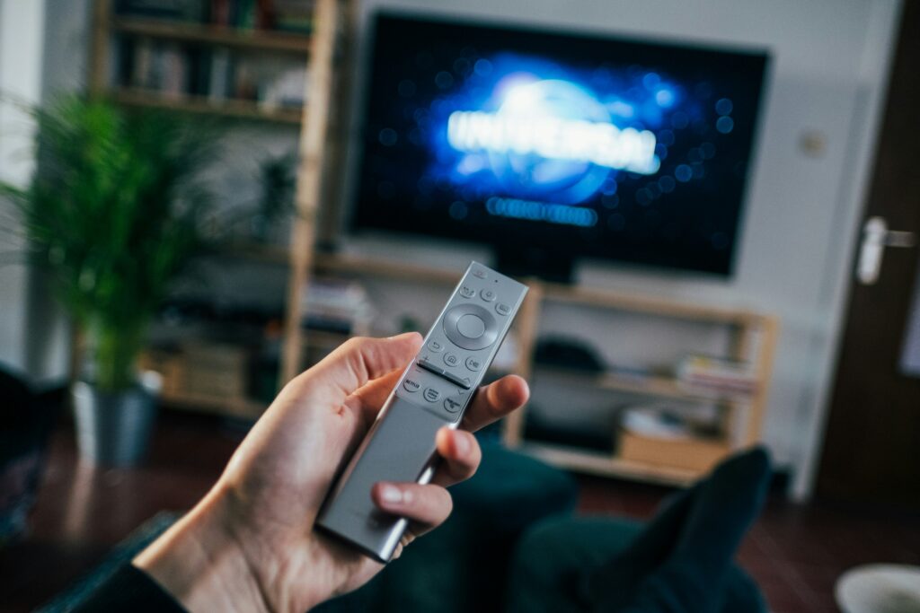 •"User navigating privacy settings on a smart TV remote control"